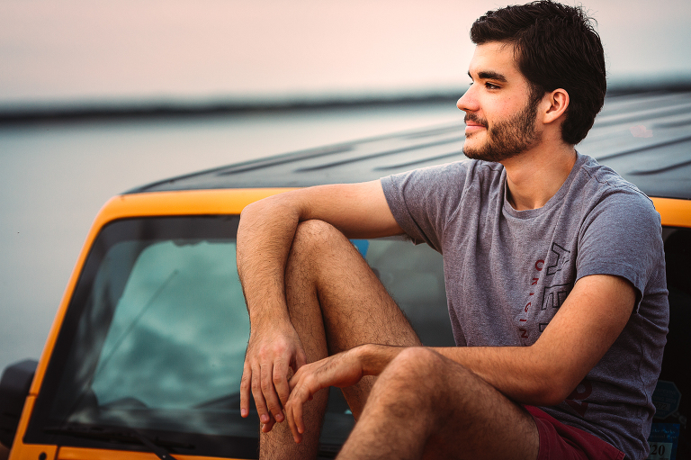 Senior guy jeep poses